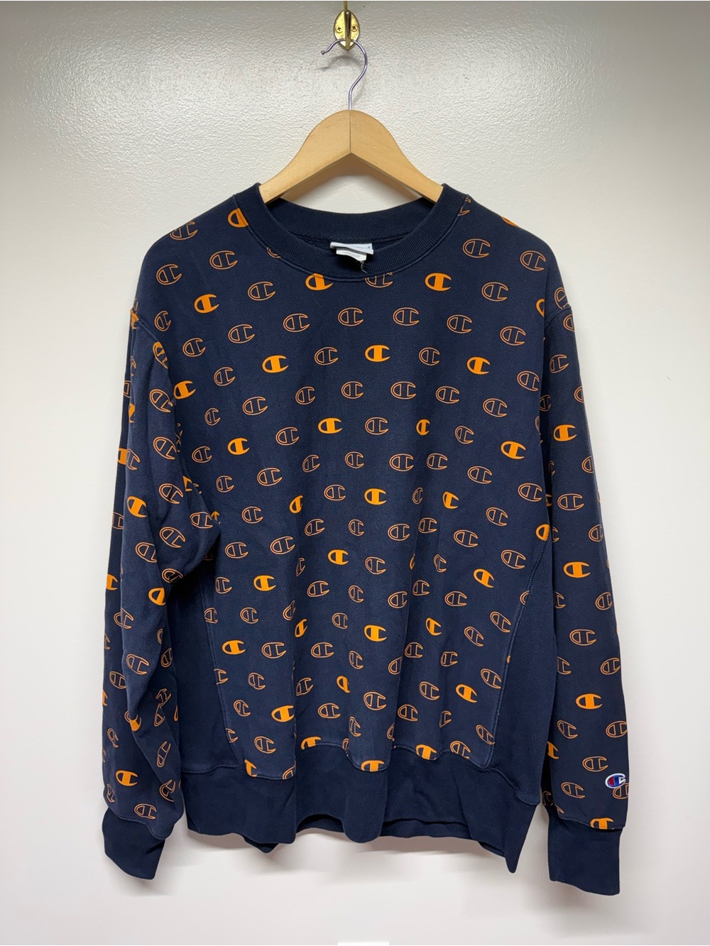 Champion Navy Crewneck Sweatshirt with Orange Logo Pattern